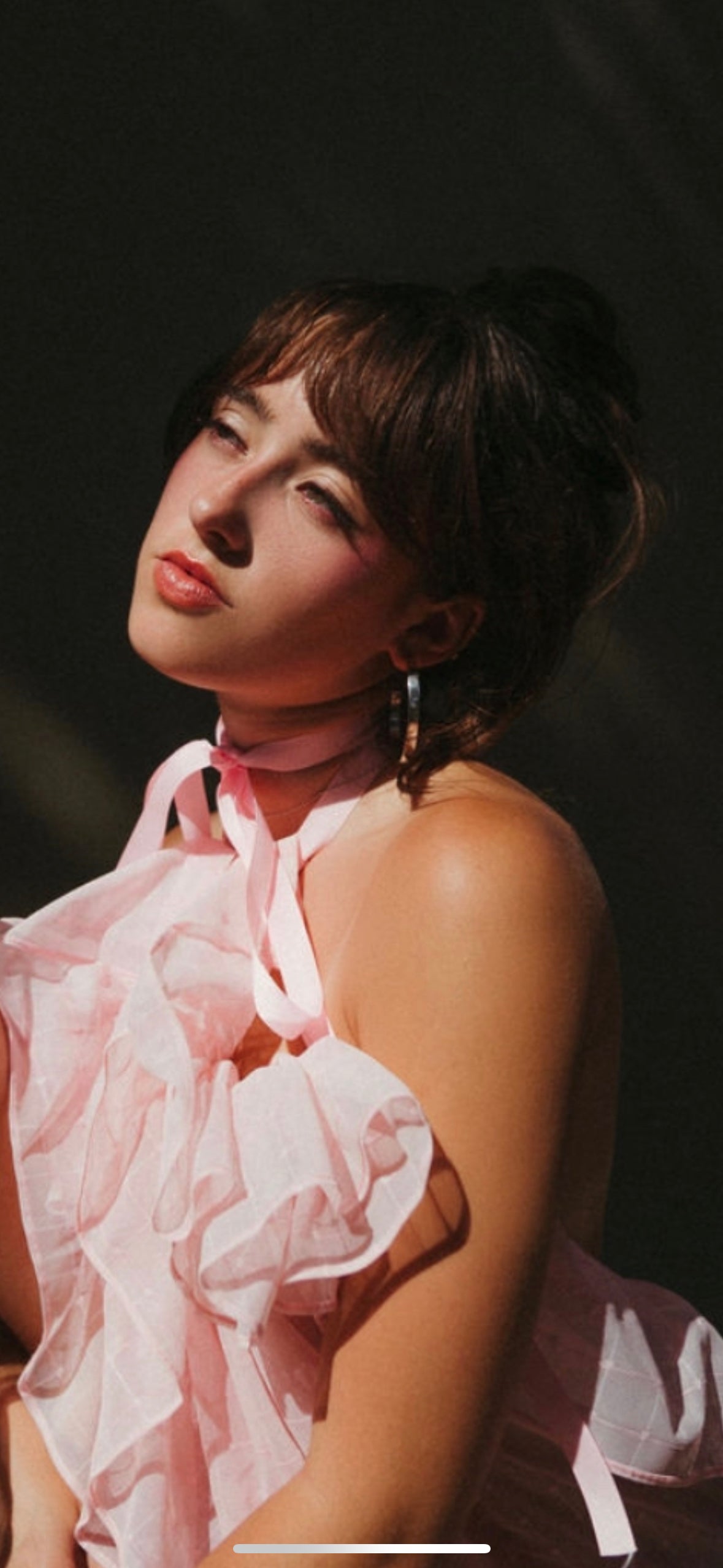 woman wearing high polished silver hoops