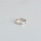 Silver stacking band with a hammered finish