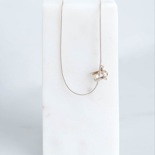Handmade silver know pendant suspended on a silver snake chain at 18inchs. 