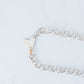 Handmade silver chain with hammered heart pendant with a 10K Yellow gold trigger clasp.